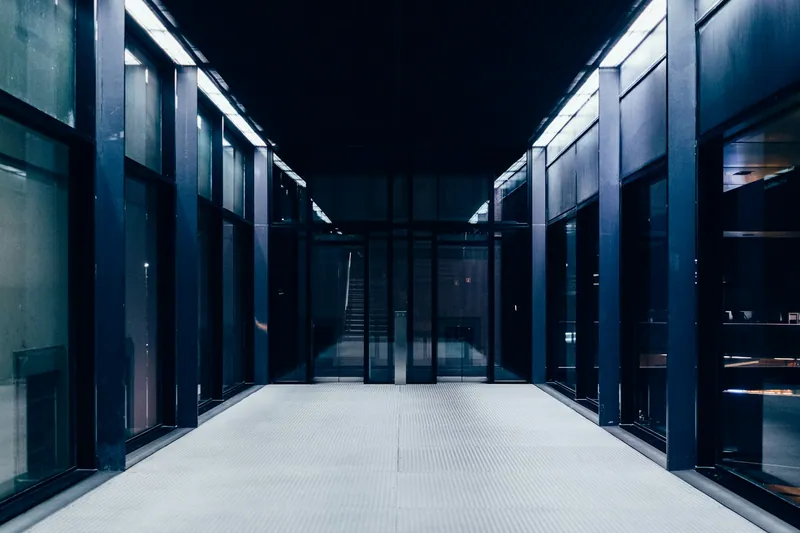 A long data centre corridor lined with server cabinets