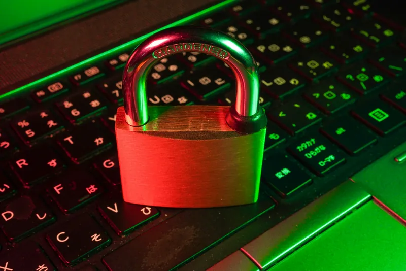 A padlock resting on a laptop keyboard